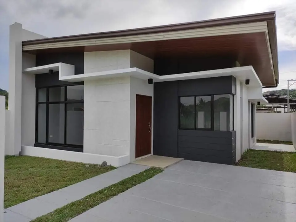 Front of a delivered single storey AnCor house with dark grey and white walls